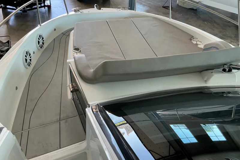 Slide: The Image of 2027 NX Boats 41 Horizon deck with cushioned seating and sleek design. - 17
