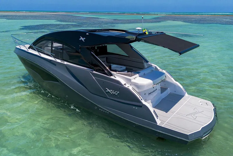 The Image of Manufacturer Provided Image: 2025 NX Boats 41 Horizon cruising in clear turquoise waters. - 1