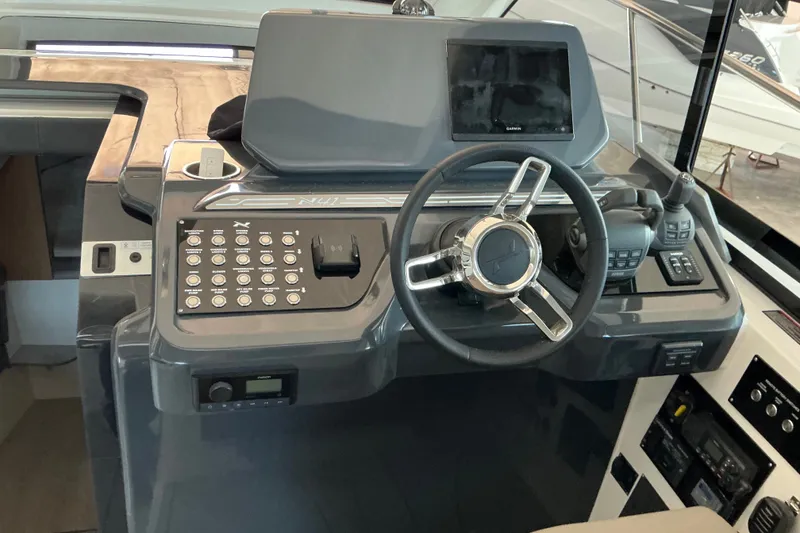 Slide: The Image of Helm of 2027 NX Boats 41 Horizon featuring modern controls and navigation system. - 22