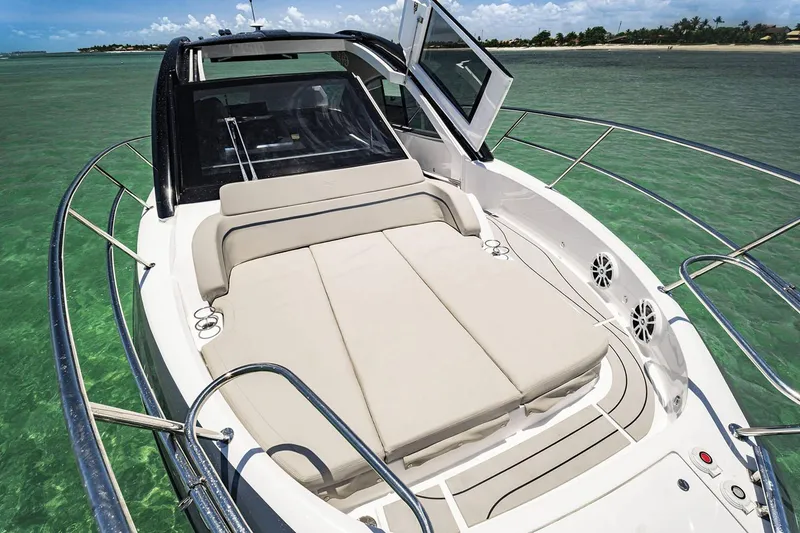 Slide: The Image of Manufacturer Provided Image: 2025 NX Boats 41 Horizon on clear water, featuring spacious sunbathing deck. - 2
