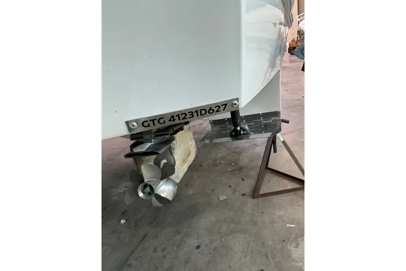 Slide: The Image of Rear view of 2027 NX Boats 41 Horizon propeller and hull in a workshop. - 10
