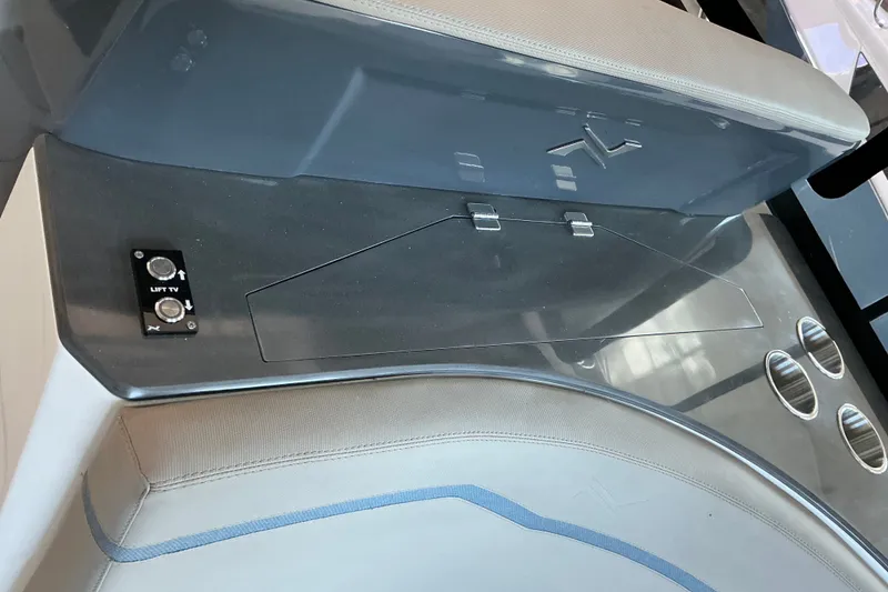 Slide: The Image of Control panel on NX Boats 41 Horizon 2027 with TV lift buttons and cup holders. - 21