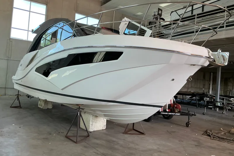 Slide: The Image of 2027 NX Boats 41 Horizon yacht in a showroom, showcasing sleek design and modern features. - 9