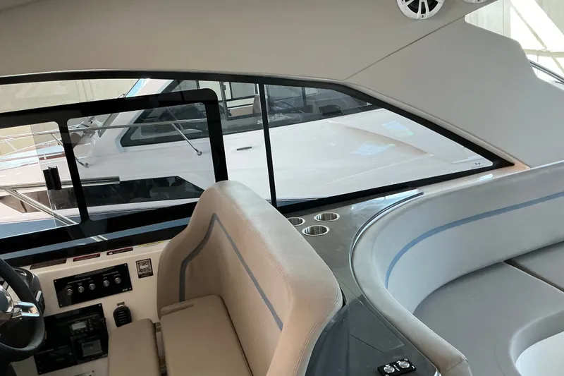 Slide: The Image of Interior view of 2027 NX Boats 41 Horizon, showcasing helm and seating area. - 25