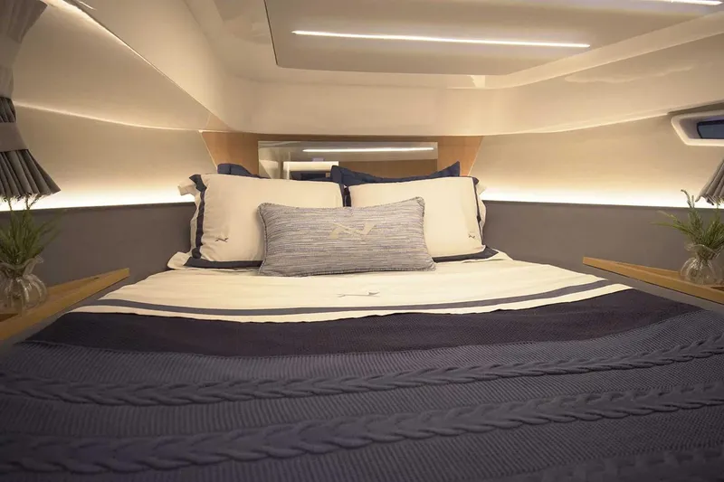 Slide: The Image of Manufacturer Provided Image: Luxurious interior cabin of 2025 NX Boats 41 Horizon with elegant bedding. - 7