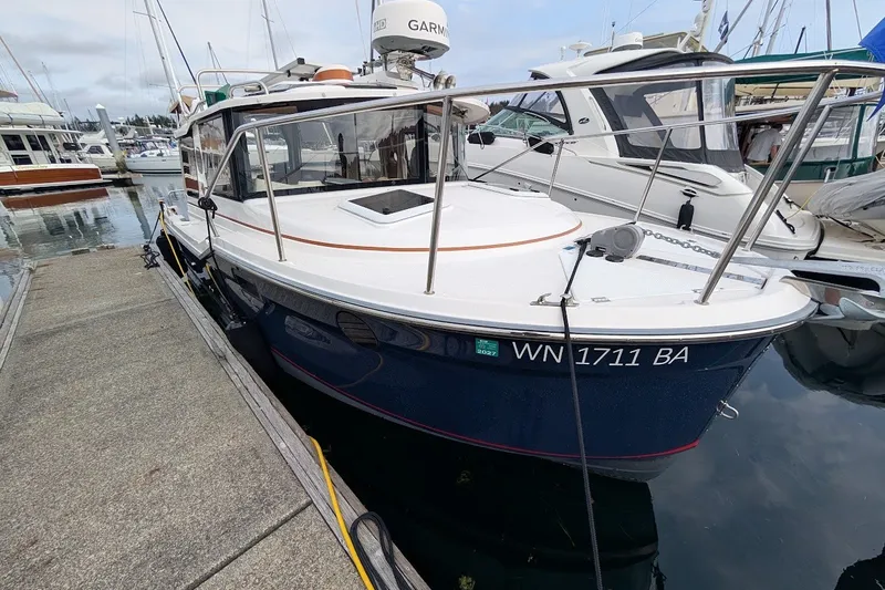 Slide: The Image of 2023 Ranger Tugs boat docked at marina, featuring sleek design and modern equipment. - 3