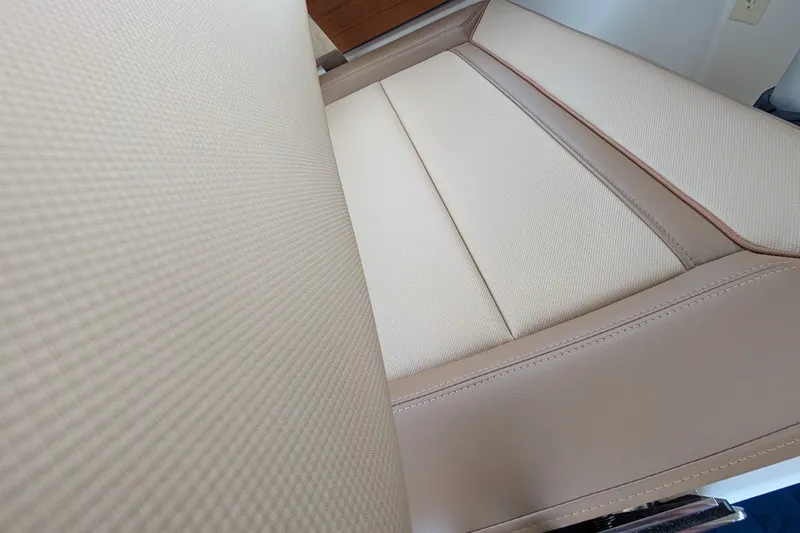 Slide: The Image of Beige leather seating detail on 2023 Ranger Tugs boat interior. - 20