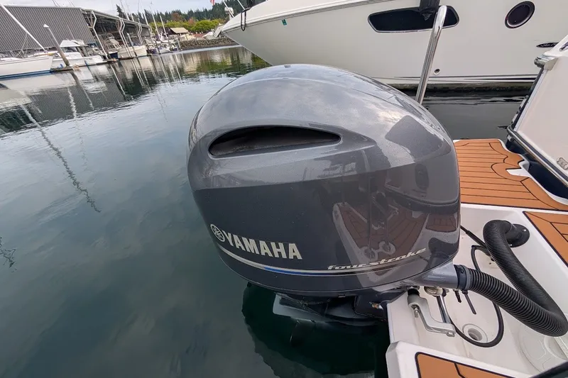 Slide: The Image of Yamaha four-stroke outboard motor on 2023 Ranger Tugs boat, docked at marina. - 25
