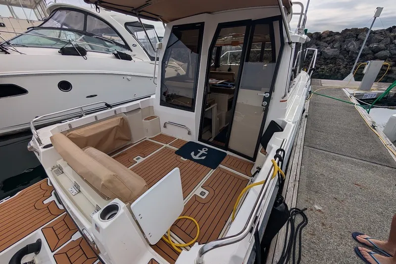 Slide: The Image of 2023 Ranger Tugs boat with open deck, docked at marina. - 33