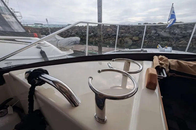 Slide: The Image of 2023 Ranger Tugs boat deck with stainless steel fittings and mooring ropes. - 21