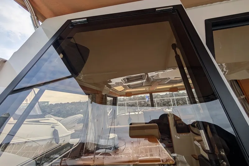 Slide: The Image of 2023 Ranger Tugs boat interior with large windows and modern design. - 34