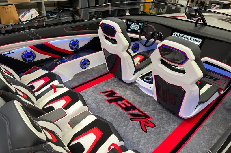 Slide: The Image of 2023 Daves Custom Boats M37R interior with modern seats and vibrant lighting. - 10