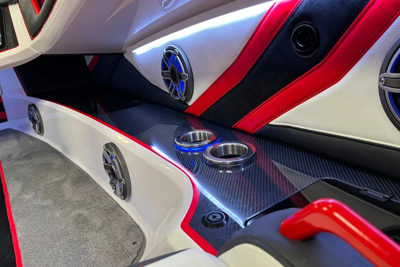 Slide: The Image of Interior of 2023 Daves Custom Boats M37R with sleek design, speakers, and cup holders. - 15