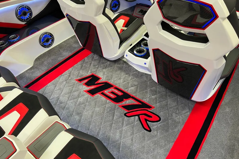 Slide: The Image of 2023 Daves Custom Boats M37R interior with stylish seating and vibrant red accents. - 12