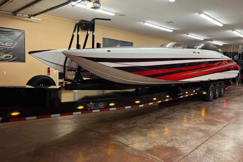 Slide: The Image of 2023 Daves Custom Boats M37R on trailer in a well-lit garage. - 1