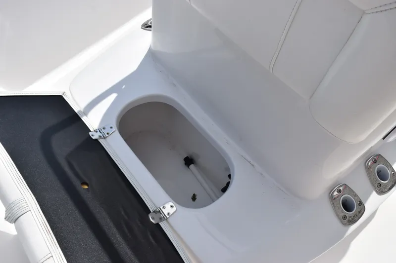 Slide: The Image of 2020 Sportsman Tournament 214 Bay Boat storage compartment with rod holders and seating. - 15