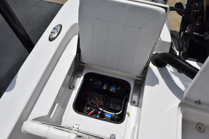 Slide: The Image of 2020 Sportsman Tournament 214 Bay Boat battery compartment with open seat cover. - 12
