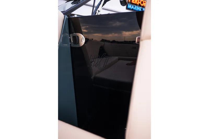 Slide: The Image of Interior view of 2027 MasterCraft NXT24 boat, showcasing sleek design and comfortable seating. - 26