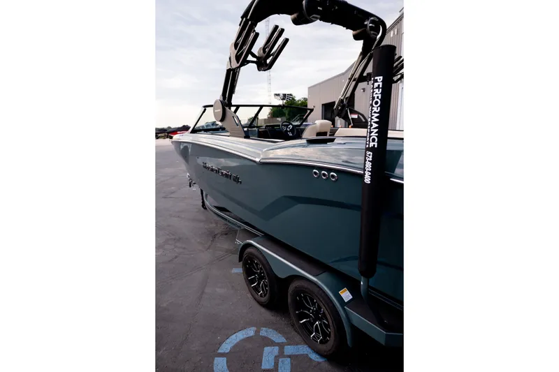 Slide: The Image of 2027 MasterCraft NXT24 boat on trailer, featuring sleek design and modern accessories. - 14