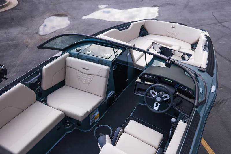 Slide: The Image of 2027 MasterCraft NXT24 boat interior with modern seating and sleek dashboard design. - 17