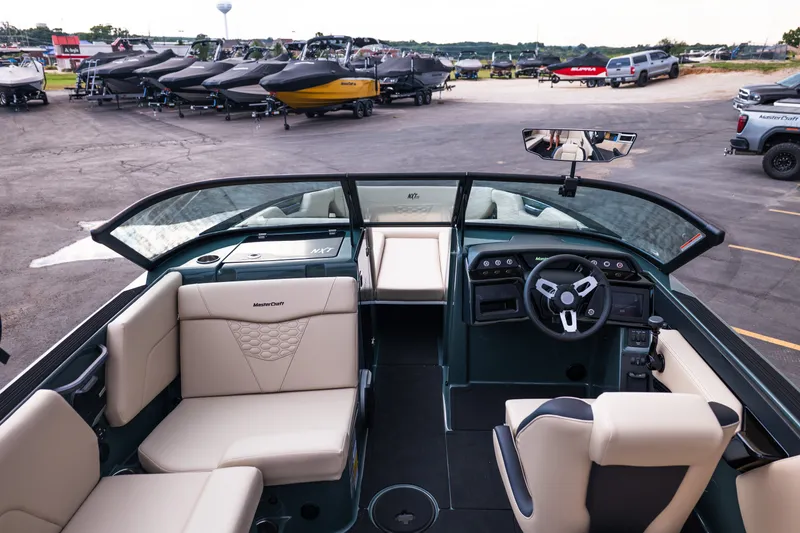 Slide: The Image of Interior view of a 2027 MasterCraft NXT24 boat with luxurious seating and modern dashboard. - 22
