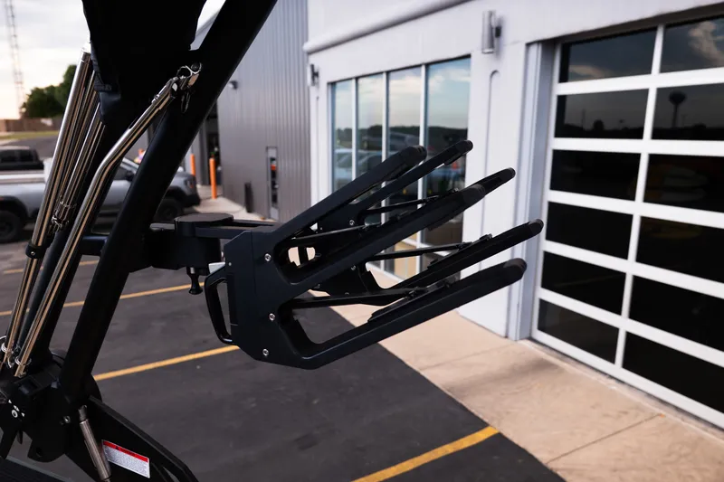 Slide: The Image of 2027 MasterCraft NXT24 boat accessory detail in a parking lot setting. - 20