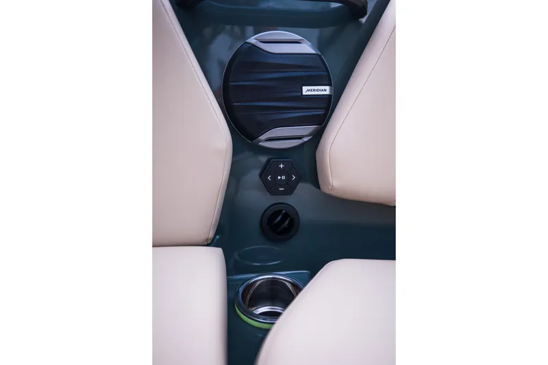 Slide: The Image of Interior of 2027 MasterCraft NXT24 boat featuring Meridian speaker and control panel. - 36