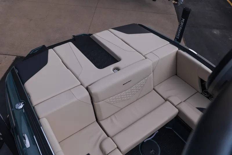 Slide: The Image of 2027 MasterCraft NXT24 boat interior with beige seating and modern design. - 18
