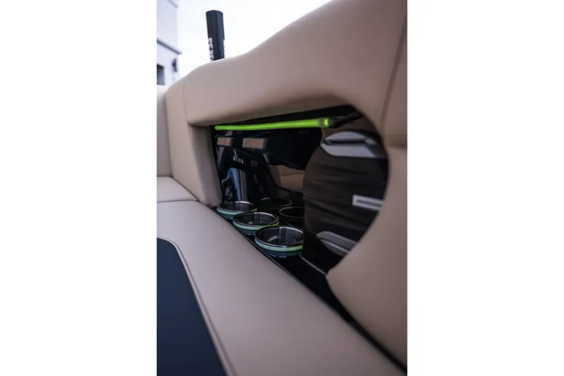 Slide: The Image of Interior of 2027 MasterCraft NXT24 boat featuring cup holders and speaker system. - 37