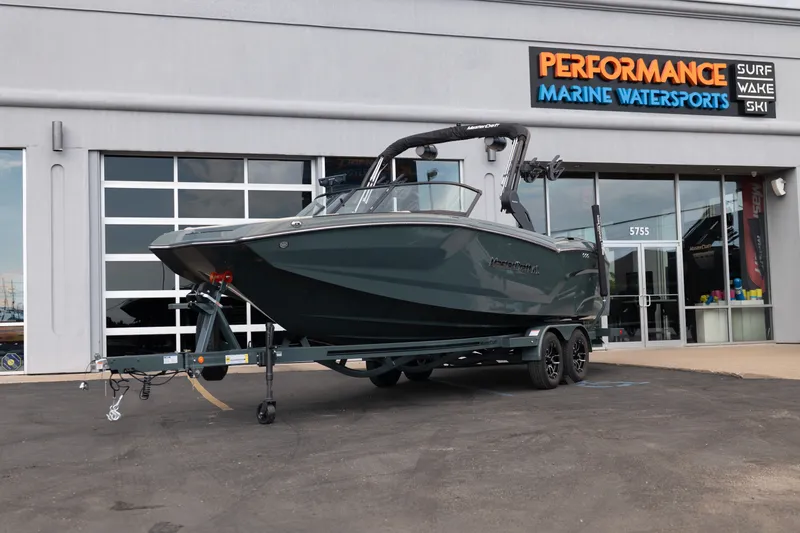 The Image of 2027 MasterCraft NXT24 boat on trailer at Performance Marine Watersports dealership. - 1