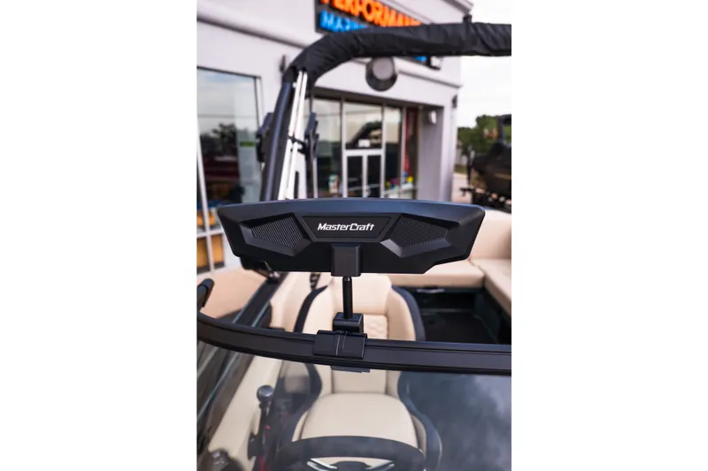 Slide: The Image of 2027 MasterCraft NXT24 boat interior with branded rearview mirror. - 28