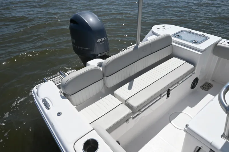 Slide: The Image of 2024 Sea Fox 228 Commander boat interior with seating and Yamaha 200 engine. - 21