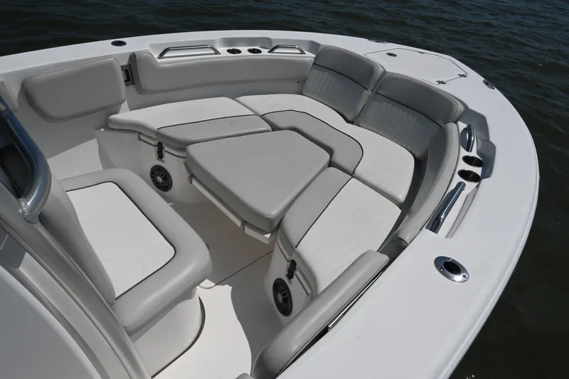 Slide: The Image of The 2024 Sea Fox 228 Commander features an elegant, cushioned seating arrangement in the bow area. - 13