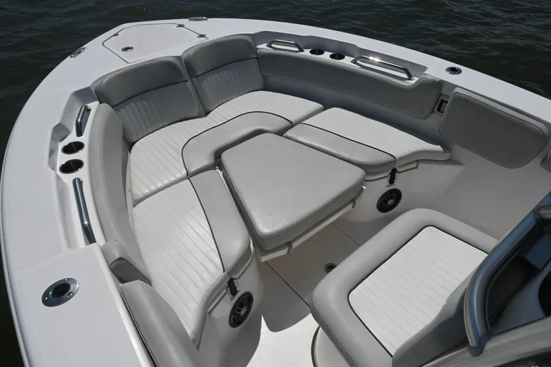 Slide: The Image of The image shows the bow area of a 2024 Sea Fox 228 Commander boat with cushioned seating. - 12