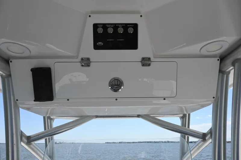 Slide: The Image of 2024 Sea Fox 228 Commander boat console with control panel and storage compartment. - 28