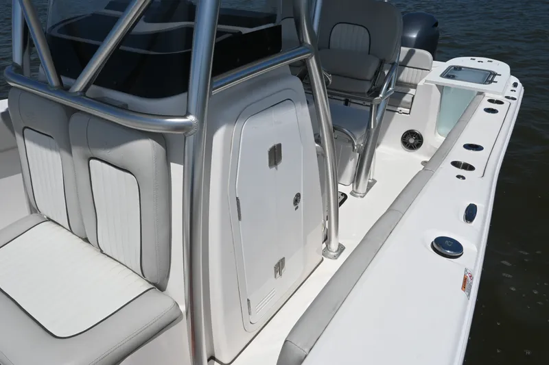 Slide: The Image of 2024 Sea Fox 228 Commander boat interior with seating and storage compartments. - 18