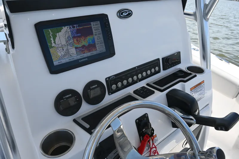 Slide: The Image of 2024 Sea Fox 228 Commander dashboard with Garmin navigation system and Yamaha gauges. - 27
