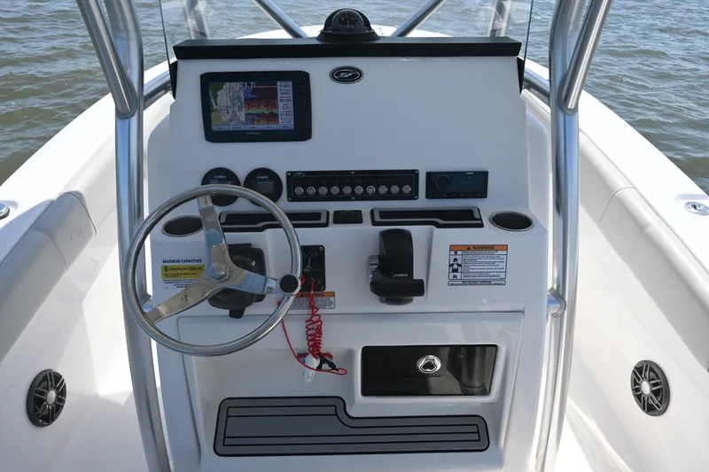 Slide: The Image of 2024 Sea Fox 228 Commander boat console with steering wheel and navigation display. - 26