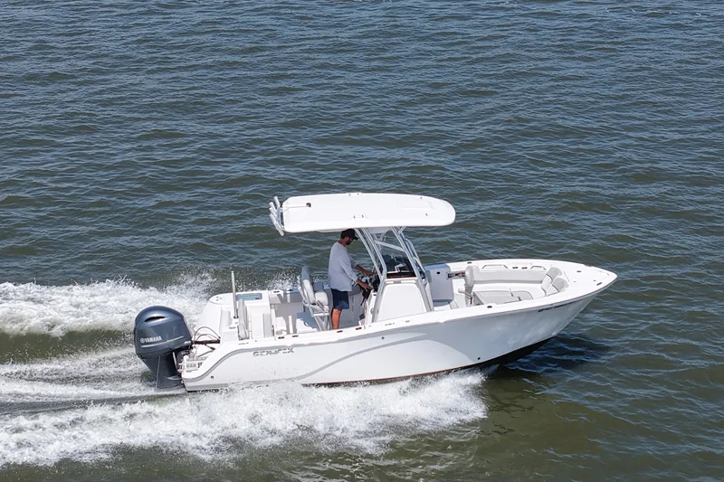 Slide: The Image of A white Sea Fox 228 Commander boat speeding across the water. - 11
