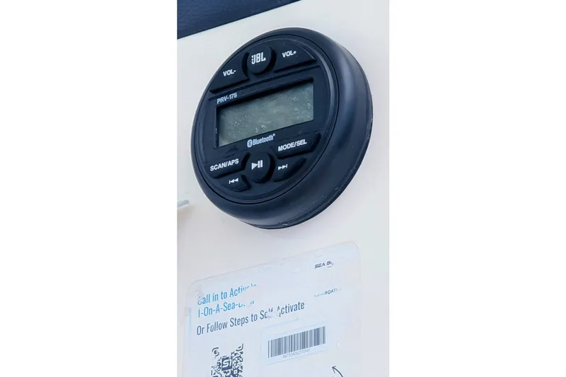 Slide: The Image of JBL audio system on 2026 Sea Born LX22 Center Console boat dashboard. - 19