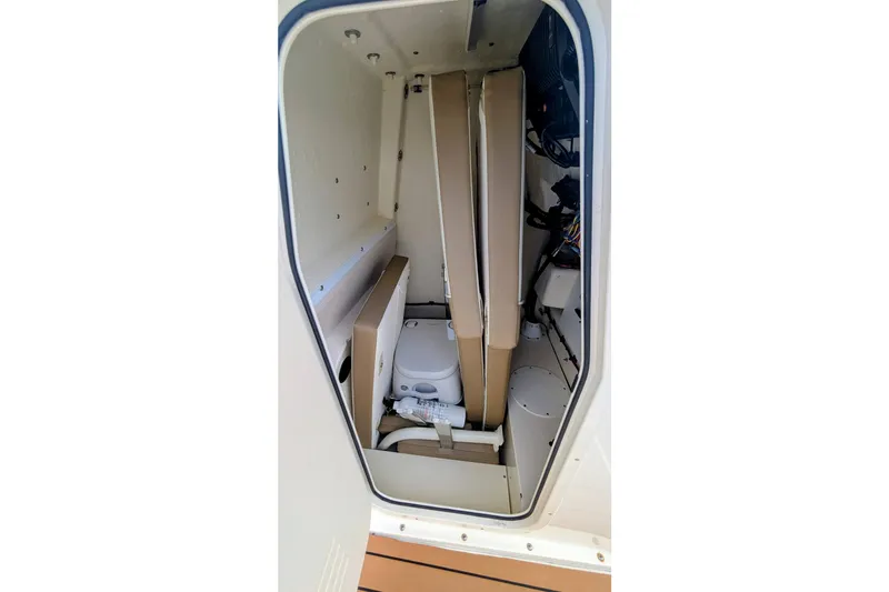 Slide: The Image of Interior view of 2026 Sea Born LX22 Center Console boat's storage compartment. - 27