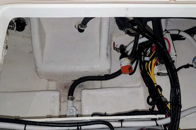 Slide: The Image of Bilge area of 2026 Sea Born LX22 Center Console with wiring and pump components. - 38