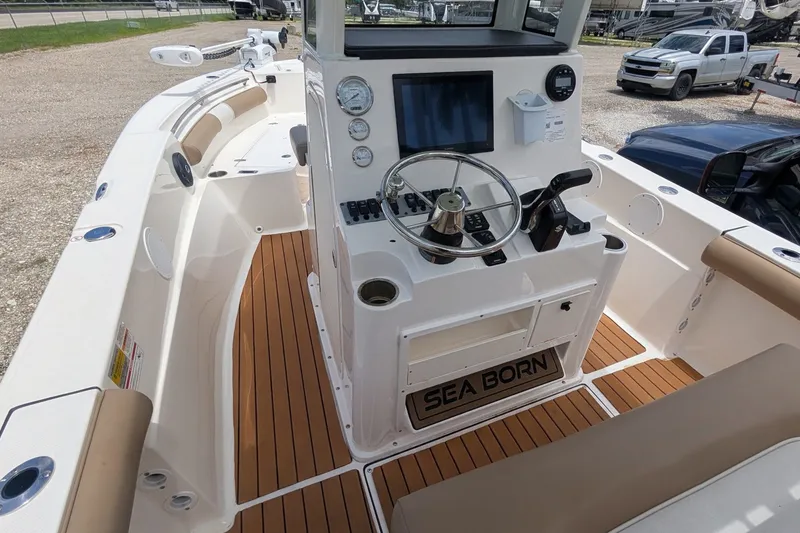Slide: The Image of 2026 Sea Born LX22 Center Console boat interior with modern dashboard and seating. - 13