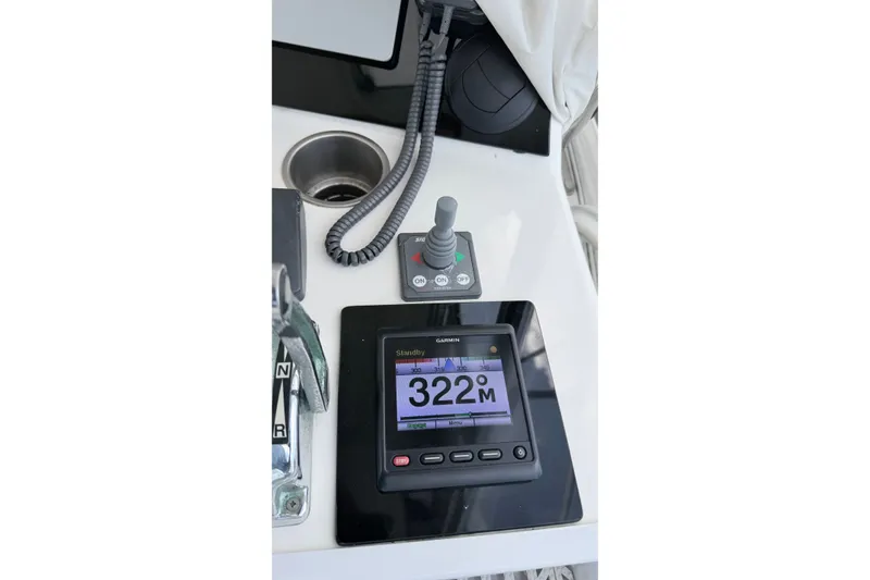 Slide: The Image of Control panel of 2005 Riviera 51 Flybridge with Garmin display and joystick. - 11