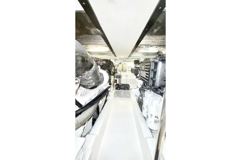 Slide: The Image of Engine room of 2005 Riviera 51 Flybridge yacht, showcasing mechanical components and systems. - 16
