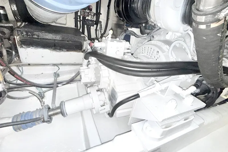 Slide: The Image of Engine compartment of a 2005 Riviera 51 Flybridge yacht, showcasing mechanical components. - 17