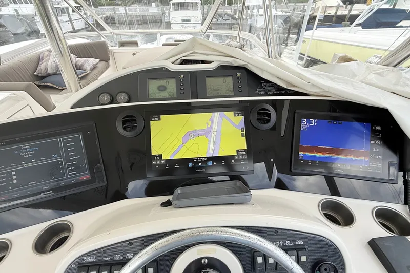 Slide: The Image of Helm of 2005 Riviera 51 Flybridge with navigation screens and controls. - 9