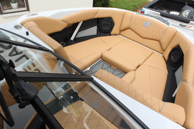 Slide: The Image of 2027 Tigé Z3 boat interior with tan leather seating and modern design. - 17