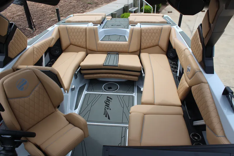 Slide: The Image of Luxurious interior of 2027 Tigé Z3 boat with tan leather seating and modern design. - 19