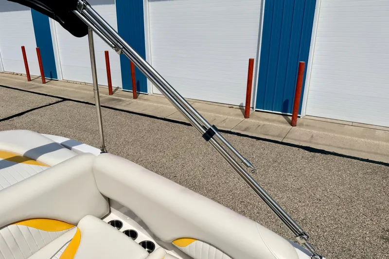 Slide: The Image of 2008 Starcraft Aurora Star Step 190 IO boat interior with white and yellow seating. - 69
